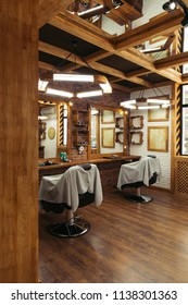Empty Chairs And Mirrors In Modern Barbershop 