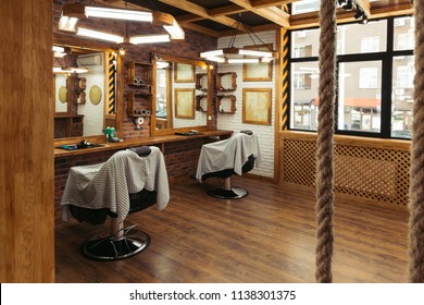 Empty Chairs And Mirrors In Modern Barbershop Interior