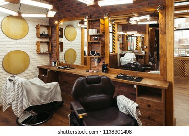 Empty Chairs Reflected In Mirrors In Modern Barbershop