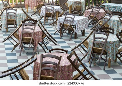 Empty Chairs And Tables At Closed Outdoor Restaurant