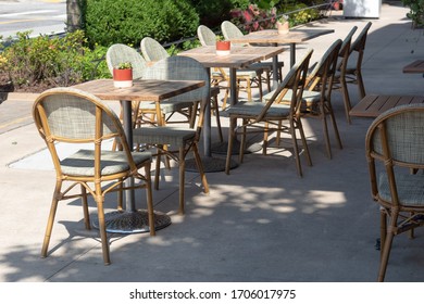 Empty Chairs And Tables In Sun And Shade As Part Of An Outdoor Cafe, No People, Horizontal Aspect