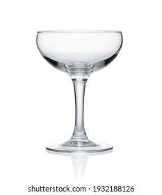 Empty champagne coupe placed on a white background