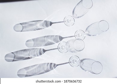 Empty Champagne Glasses Silhouette On White Background With Dark Shadow Top View Wine Drink Concept