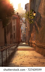 Empty, charming alley in Vieux Lyon, the old town of Lyon that is part of the UNESCO world heritage site, during sunrise.