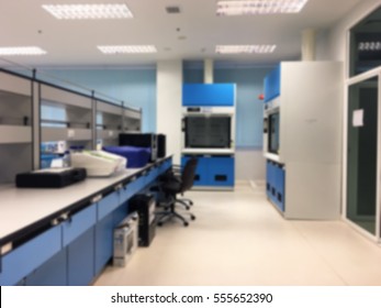 Empty Chemical Laboratory With Shelves And Furniture In Science Classroom Interior Blur Image Use For Background.