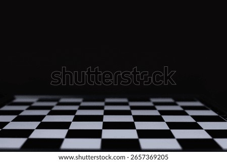 empty chess board on dark background.
