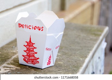 Empty Chinese Take Out Food Box That Was Put As Trash On A Counter Outside