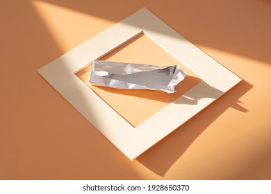 An Empty Chocolate Bar Wrapper On A White Background.