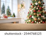 empty christmas table background with christmas tree out of focus for product display montage