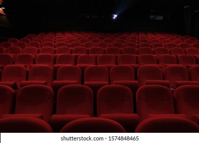 Empty cinema hall with red seats. Movie theatre - Shutterstock ID 1574848465