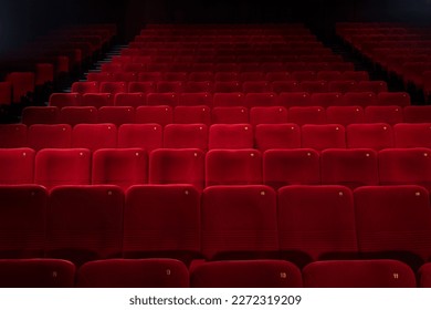 Empty cinema hall with red seats. Movie theatre, party hall.