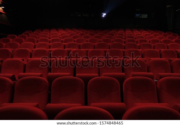 Empty cinema\
hall with red seats. Movie\
theatre