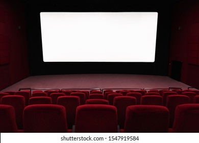 Empty Of Cinema In Red Color With White Blank Screen. Mockup Of Hall, No People And Auditorium