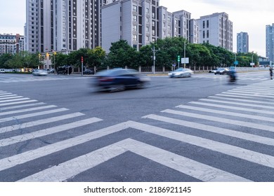 Empty City Streets And White Line Crossings