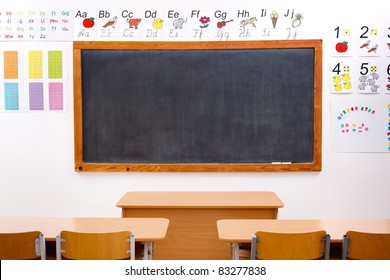 Empty Classroom And Black Chalkboard, Decorated With Letters And Numbers