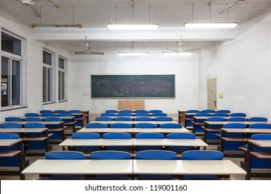 Empty Classroom With Blank Blackboard