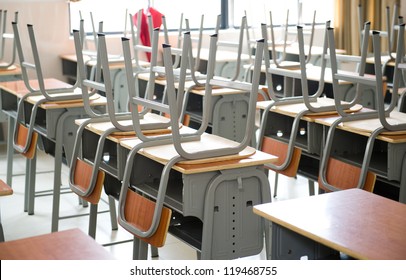 Empty classroom with chairs and desks.