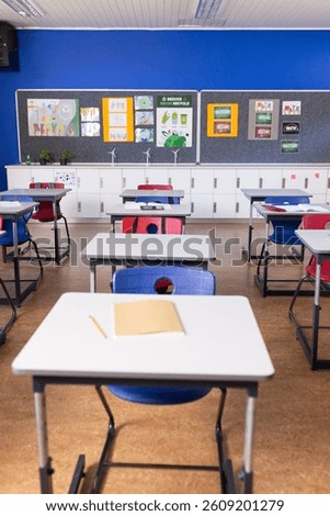 Empty classroom with desks and chairs, ready for students to arrive, copy space. Education, learning, school, preparation