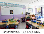 Empty Classroom In Elementary School With Whiteboard And Desks