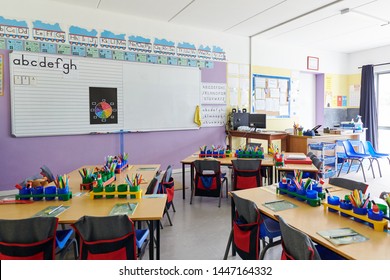 Empty Classroom In Elementary School With Whiteboard And Desks - Shutterstock ID 1447164332