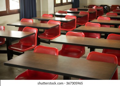 Empty classroom fill with red lecture seats