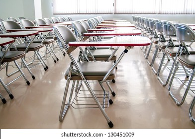 empty classroom with many armchairs