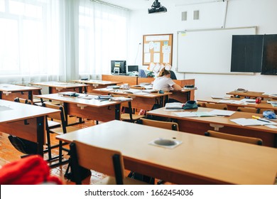 Empty classroom with school supplies, black board