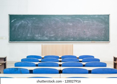 empty classroom with tables and chairs
