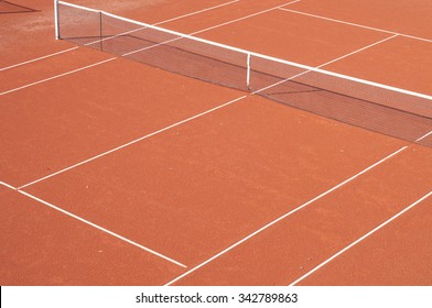 Empty Clay Tennis Court And Net Seen From Above