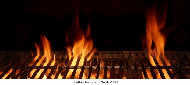 Empty And Clean Hot Flaming Charcoal Barbecue Grill With Bright Flame Isolated On Black Background. Party, Picnic, Braai, Cookout Concept