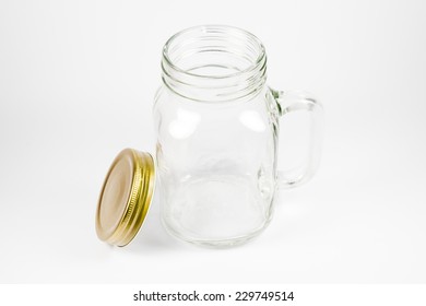 An Empty Clear Mason Jar With Lid