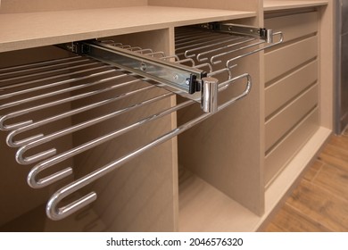 
Empty Closet With Removable Metal Accessory For Clothes Hanging