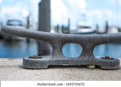 Empty coastal mooring or towing bollard for the boat, yacht or vessel. Bkue sky and marina as a background. - Powered by Shutterstock