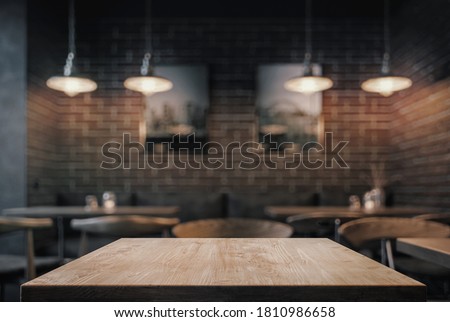 Empty coffe table at night over defocused background with copy space