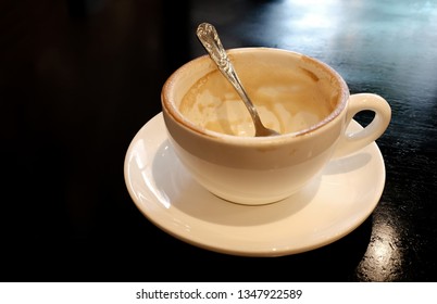 Empty coffee cup after drink on Black table 