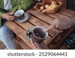 Empty coffee cup in hands of women. Fortune telling and predictions on sediment of coffee ground after breakfast