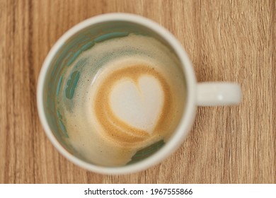 Empty Coffee Cup With Heart Shape Foam Milk On The Bottom