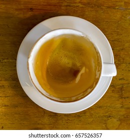 Empty coffee cup, Square image, Top view above wood table after drink in the morning at coffee shop