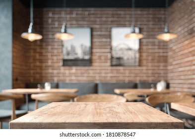Empty coffee table over defocused coffee shop background with copy space - Powered by Shutterstock