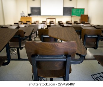 Empty College Classroom With Selective Focus On Chair In Foreground. 