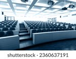 Empty college lecture hall with row of chairs