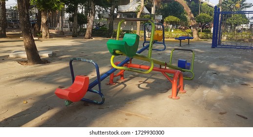 An Empty Colorful Sea Saw In The Public Playground