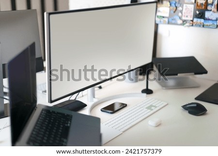 Empty computer monitors. Screen mockup. Home office studio. Workplace interior.