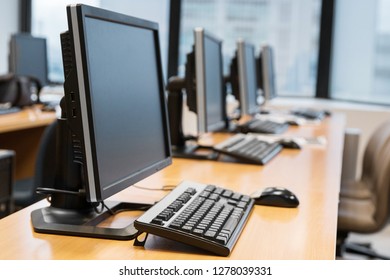 Empty Computer Room Neatly Placed For Student In A Computer Lab.