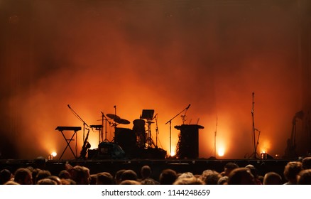 Empty Concert Stage On Music Festival, Instruments Silhouettes, Microphones Drums Guitars And Crowd Of People