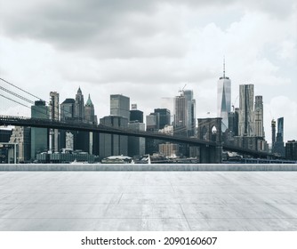 Empty concrete dirty quay on the background of a beautiful NY city skyline and Brooklyn bridge at morning, mockup