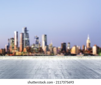 Empty concrete dirty rooftop on the background of a beautiful blurry New York city skyline at night, mockup