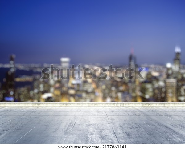 Empty concrete\
dirty rooftop on the background of a beautiful blurry Chicago city\
skyline at night, mockup