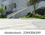 empty concrete floor in front of modern buildings in the downtown street.