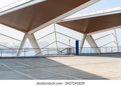 empty concrete floor in front of modern buildings in the downtown street. copy space for parking lot. - Powered by Shutterstock